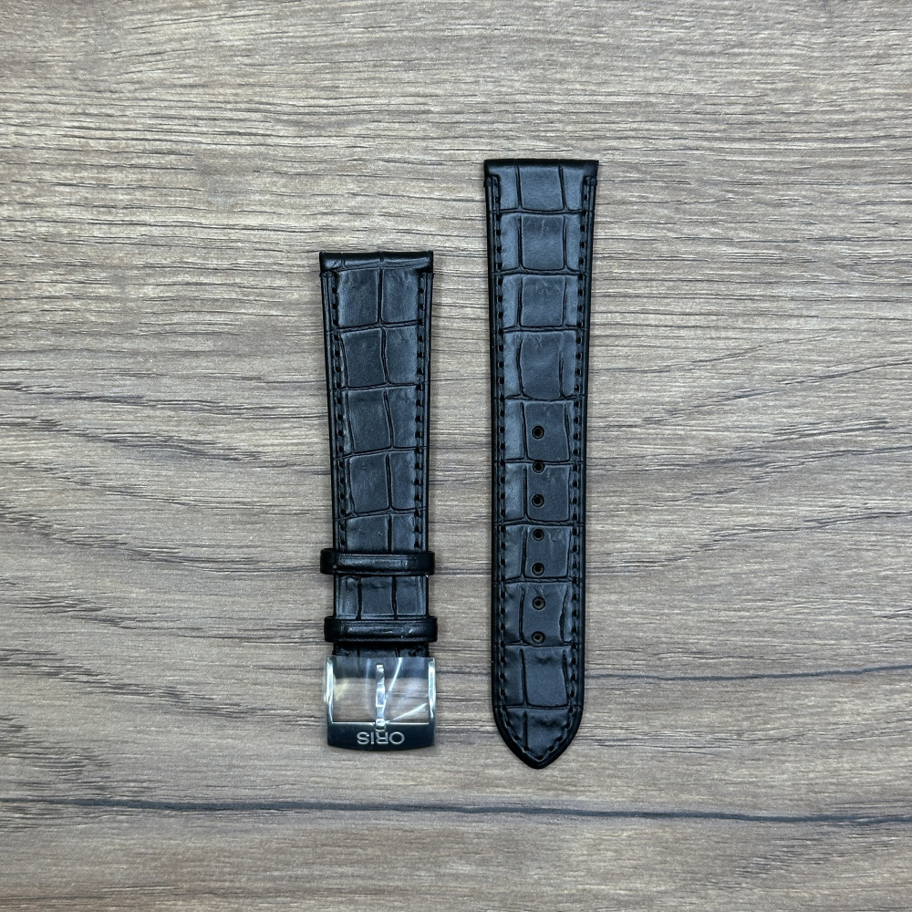 Ремешок для часов Oris из кожи, черный, с застежкой из нержавеющей стали Кожаные ремешки - стильные, надёжные и долговечные, способные составить достойную пару часам со стальным корпусом или часам из титана. Аксессуары из кожи не рекомендуется использовать в воде. У нас присутствуют только высококачественные материалы и оригинальный товар от производителя.