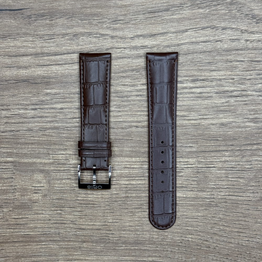 Ремешок для часов Oris из натуральной кожи, коричневый, с застежкой Кожаные ремешки - стильные, надёжные и долговечные, способные составить достойную пару часам со стальным корпусом или часам из титана. Аксессуары из кожи не рекомендуется использовать в воде. У нас присутствуют только высококачественные материалы и оригинальный товар от производителя